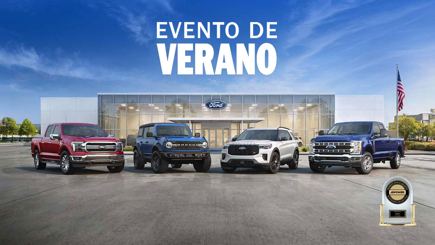 Una línea de Camionetas y SUVS Ford estacionadas en frente de un concesionario Ford